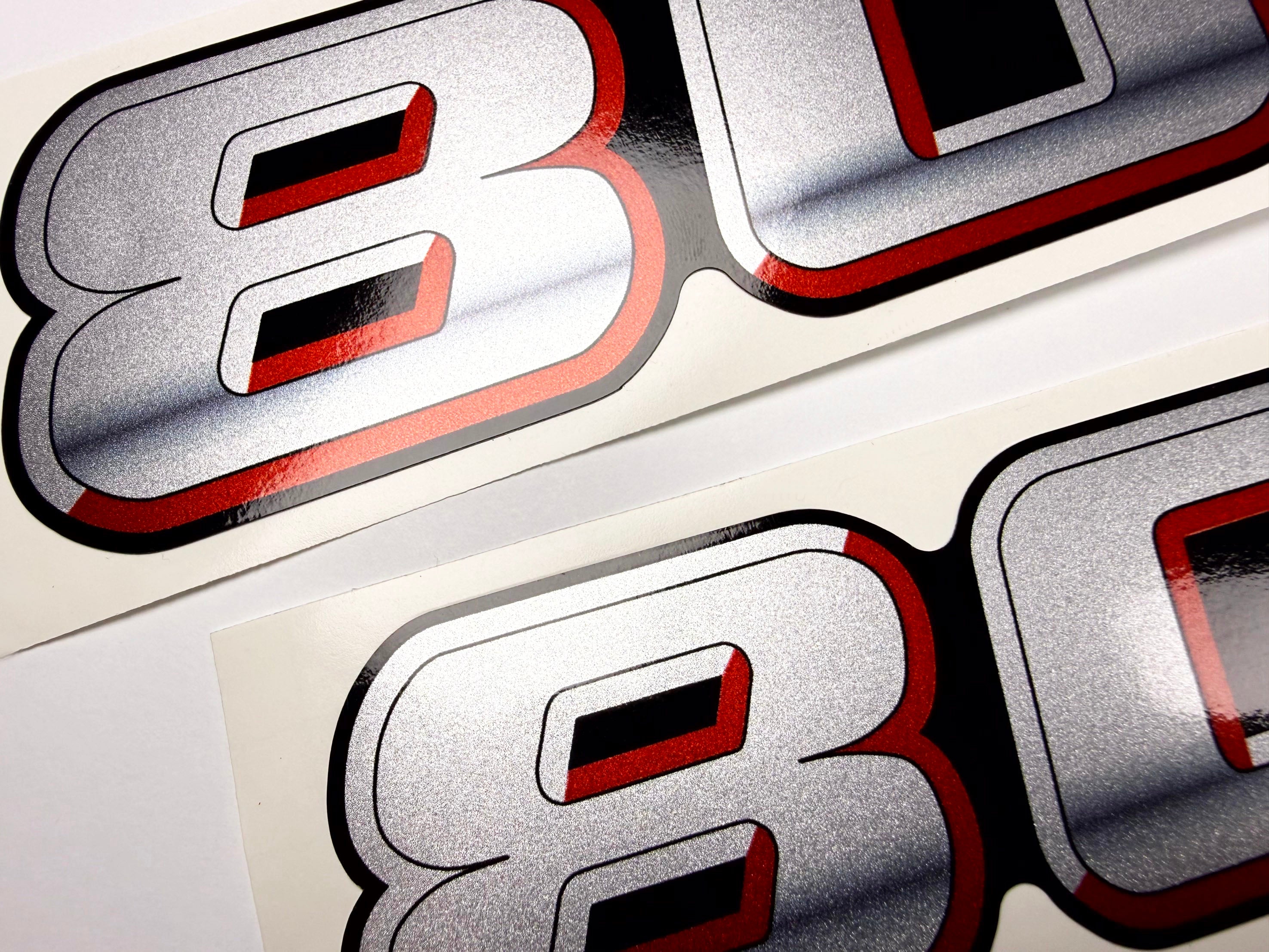 Vinyl graphic silver metalized shimmer decal numbers set suitable for Suzuki 80 hp four stroke outboard engine. Vinyl stickers number for suzuki 80 hp four stroke Handmade