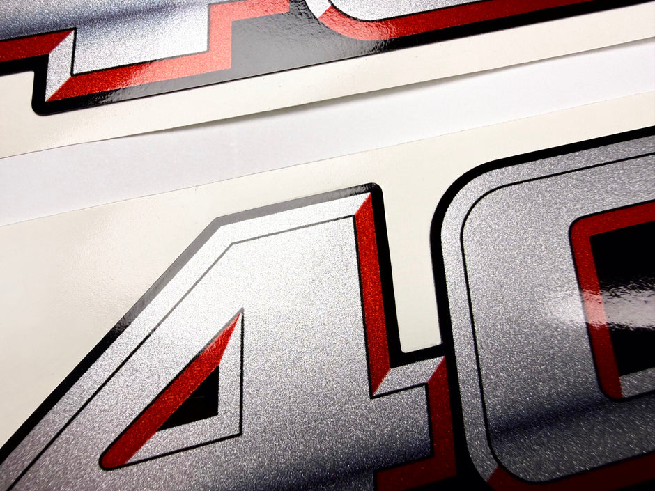 Vinyl graphic silver metalized shimmer decal numbers set suitable for Suzuki 40 hp four stroke outboard engine. Vinyl stickers number for suzuki 40 hp four stroke Handmade